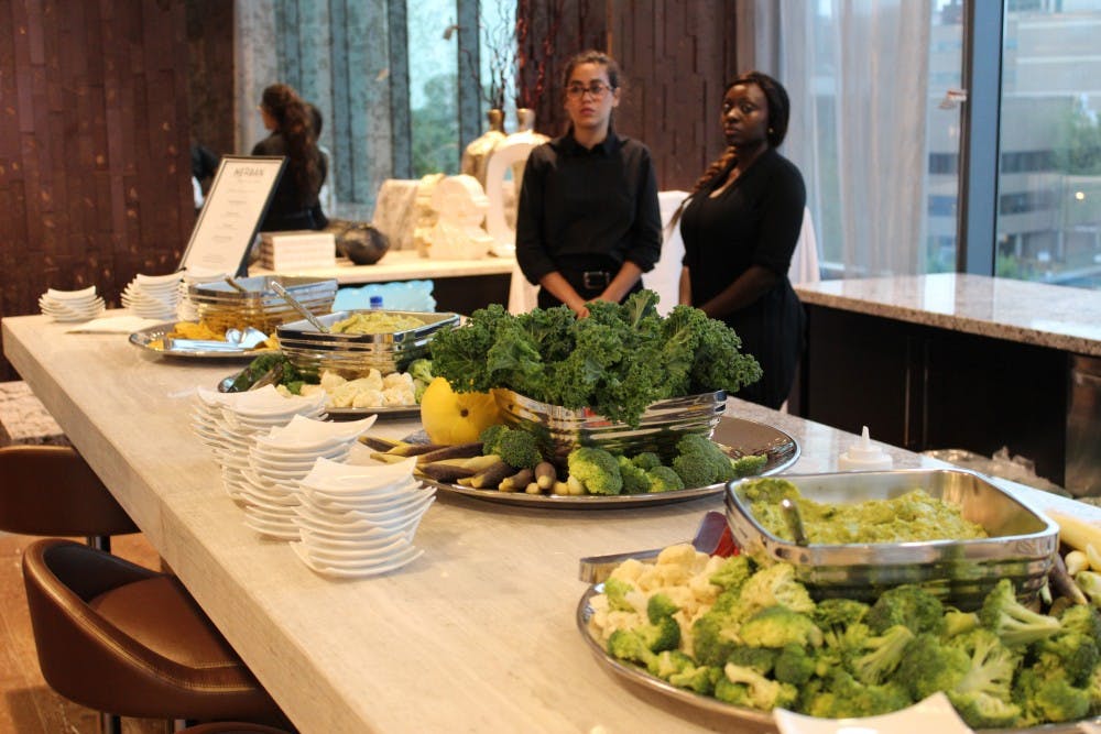 Herban Quality Eats catered the new building's opening event and provided snacks including vegetables, dips, and plantain chips.