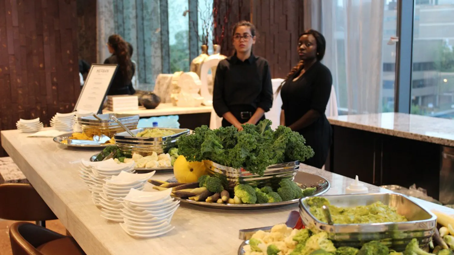 Herban Quality Eats catered the new building's opening event and provided snacks including vegetables, dips, and plantain chips.