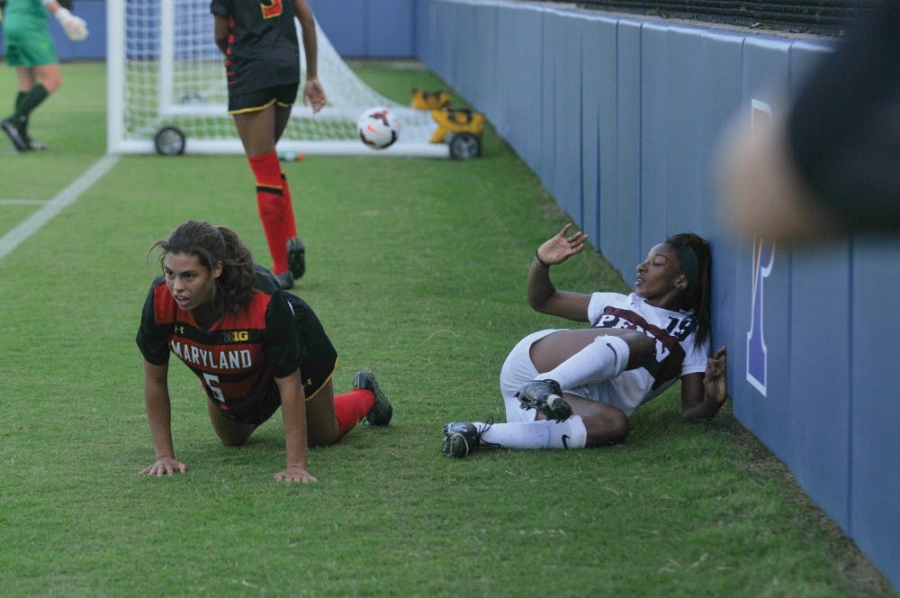 Defender Tahirih Nesmith takes a tumble after fighting to keep the ball in play.