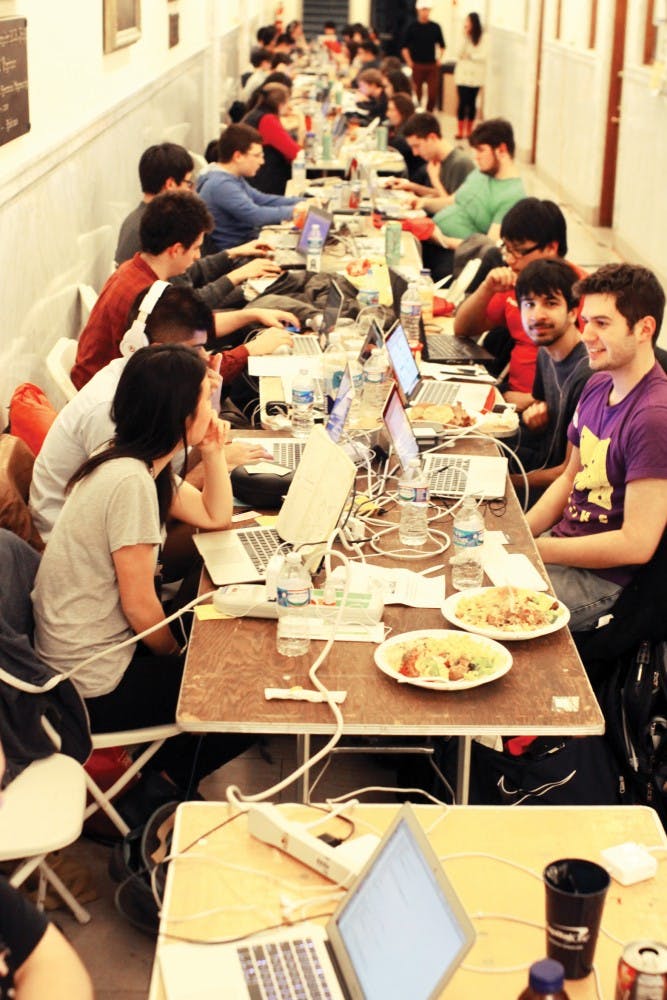 Students working together in PennApps hackathon.