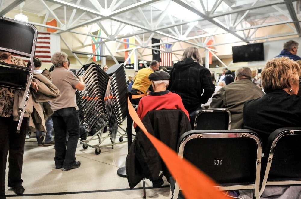 An orange rope helped divide the supporters of different candidates at the Democratic caucus in Clive, IA.