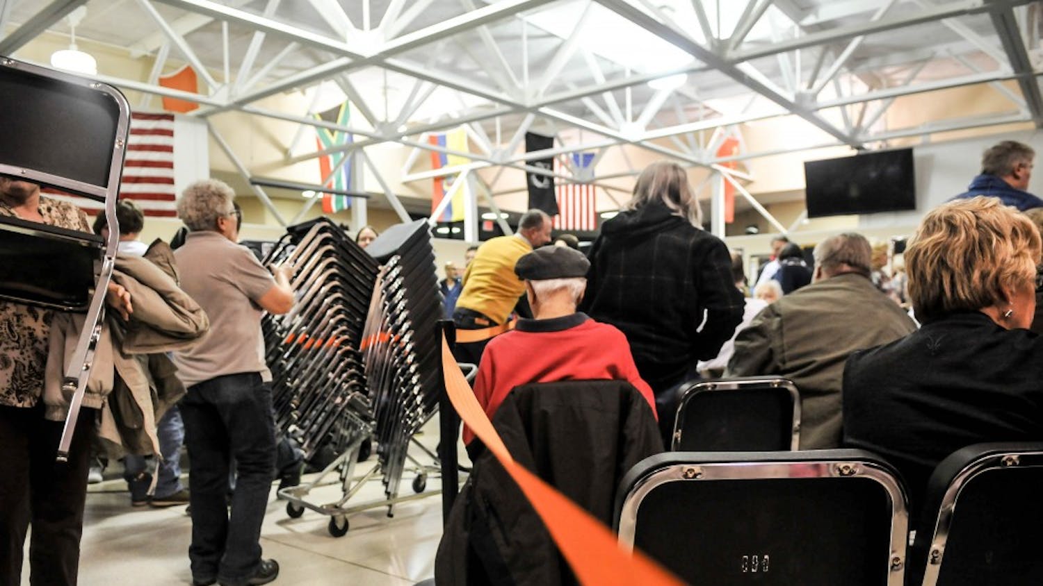 An orange rope helped divide the supporters of different candidates at the Democratic caucus in Clive, IA.