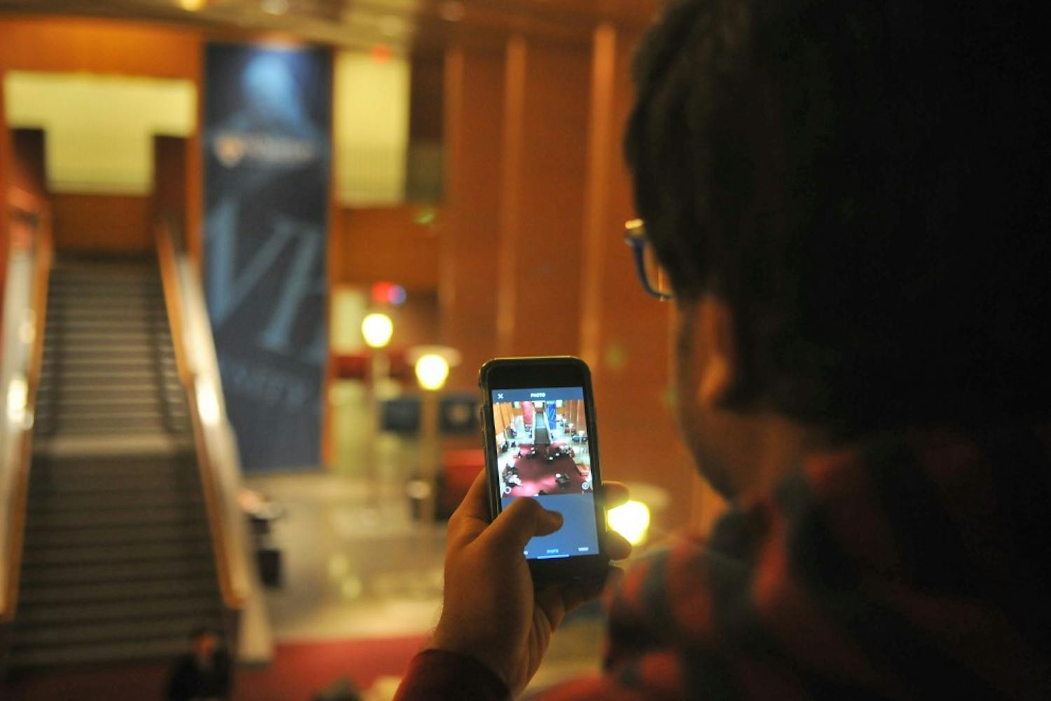 Engineering senior Ishmam Ahmed captures the Hunstman forum for Penn's Instagram.