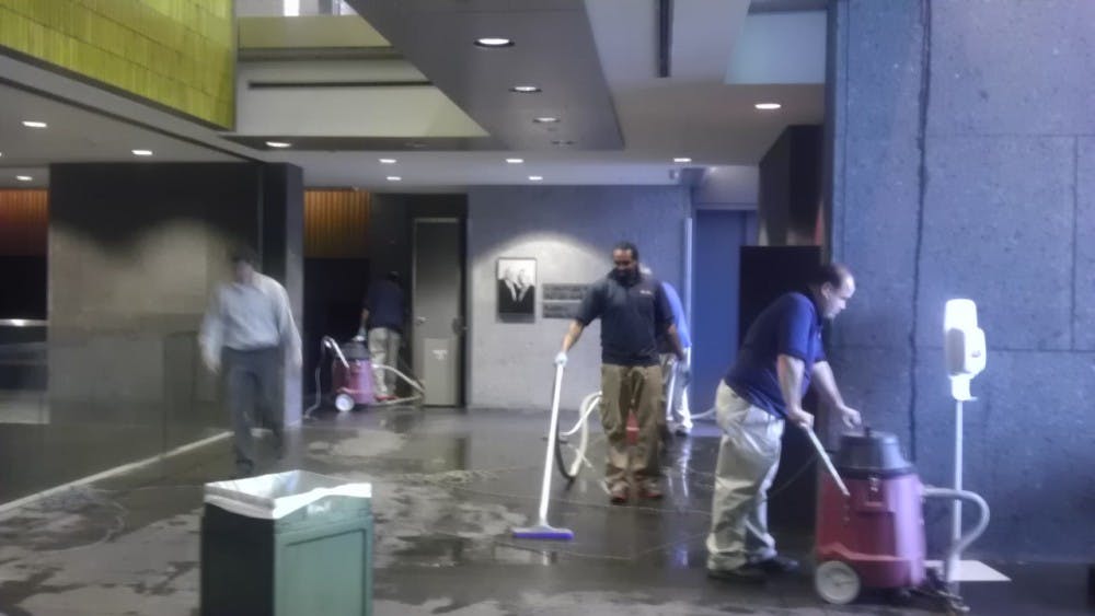 	Workers from Facilities and Real Estate Services clean up the water damage in Skirkanich Hall Friday afternoon.