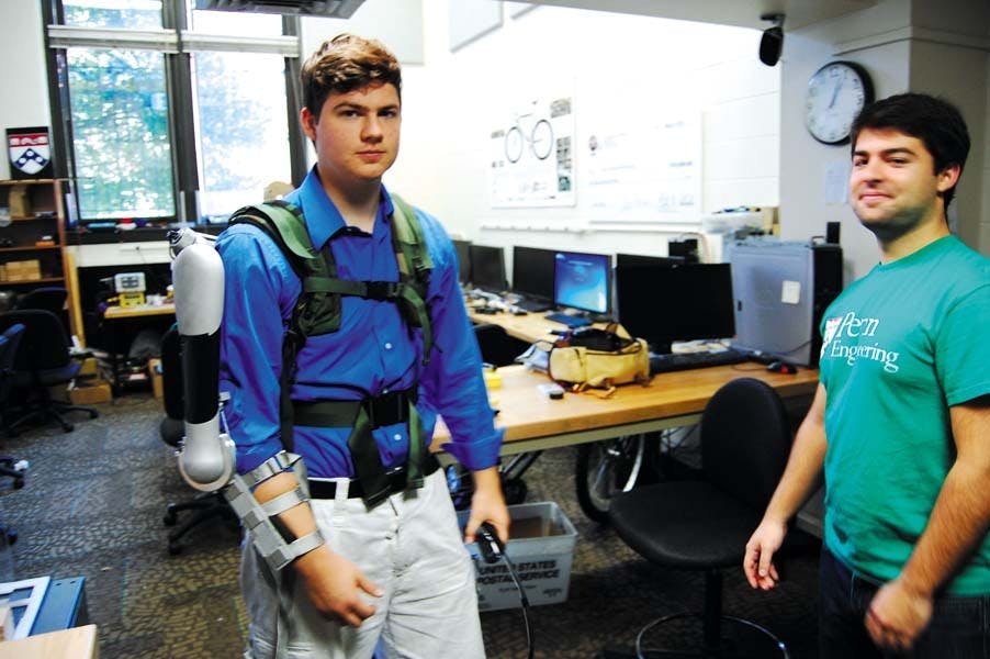 	First year School of Engineering graduate student Nicholas McGill tests out the Titanic Arm he and his teammates, including first year Engineering graduate student Nick Parrotta, designed as part of their senior design project.