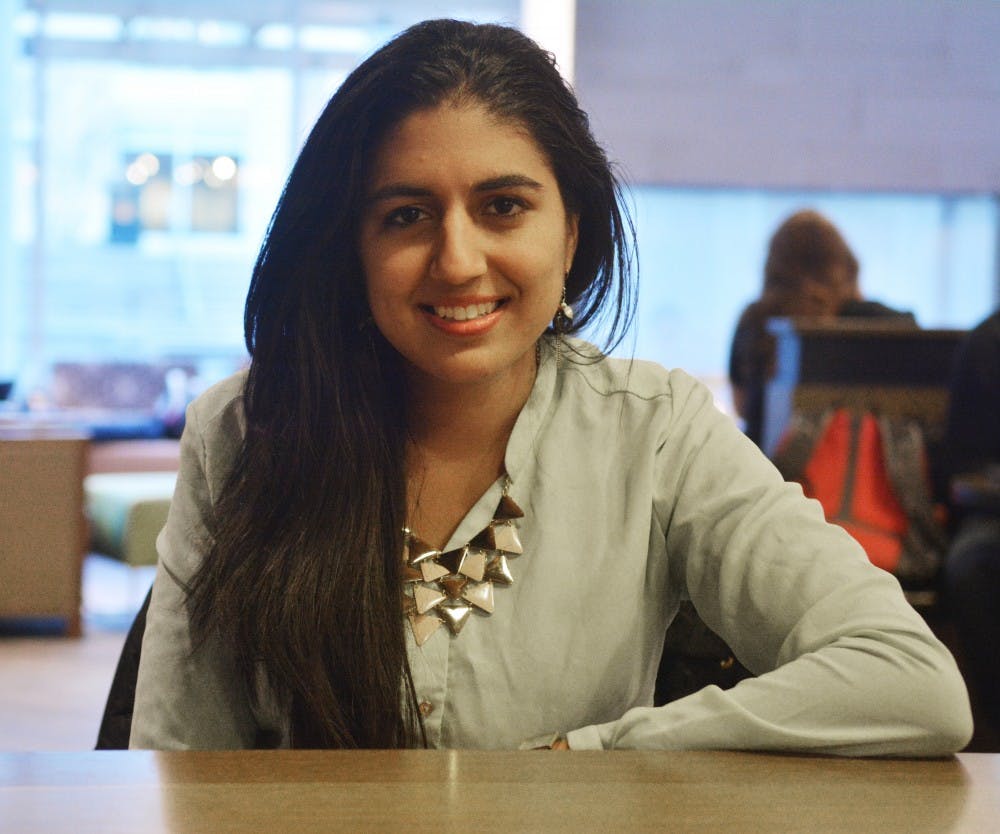 Photo illustration of an alcohol pamphlet being given out