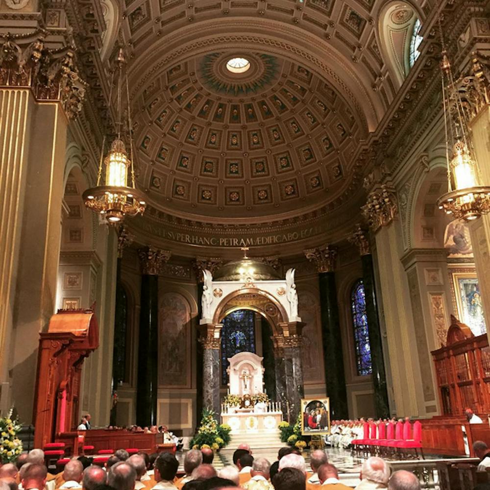 Picture of Basilica congregation before Pope Francis processed in. | Courtesy of Father Tom Whittingham.