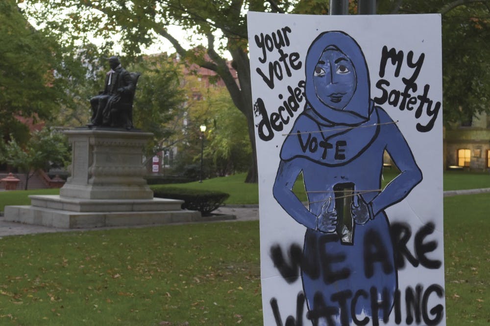 Photo Gallery | "We Are Watching": Anti-Trump Signs