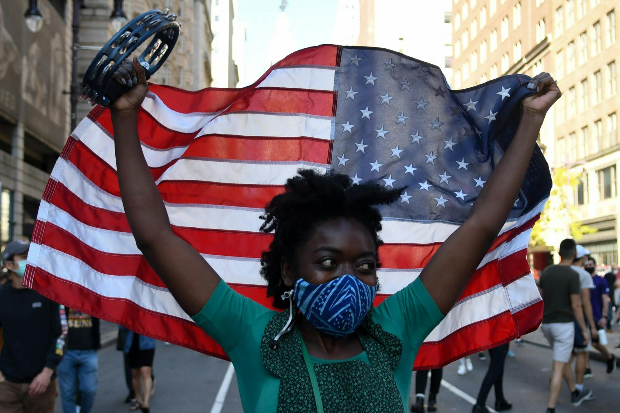11-07-20 FINAL Penn and Philadelphia Celebrates Joe Biden Elected President of the United States Black Woman and American Flag001.jpg