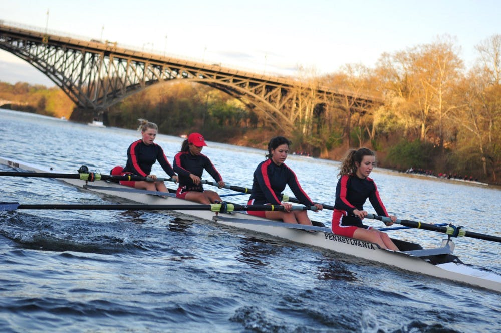 The women's and men's heavyweight rowing teams practice in the early morning on the Schuylkill. 