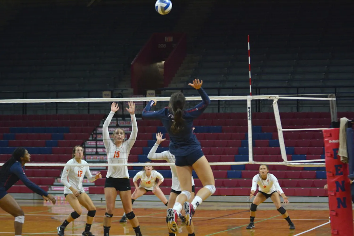 "Dirtyball" brings out the competitive spirit in the Quakers during Penn volleyball practice. Junior outside hitter Hayley Molnar (jumping, blue) is especially fierce.