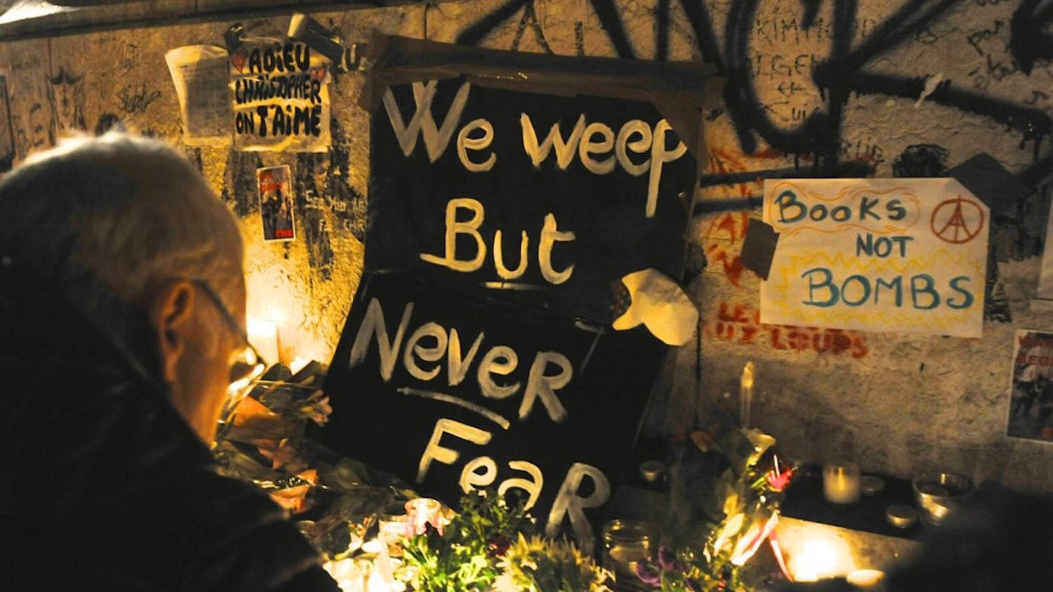 The city of Paris experienced its largest terrorist attack in history on Friday. Over the weekend, mourners gathered at a makeshift memorial next to the Bataclan concert hall where one of the attacks took place. | Courtesy of Luis A. Ferré Sadurní
