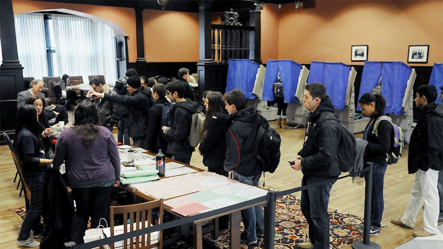 Photographs of students casting their votes in Houston Hall and Hill.