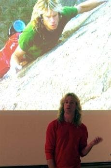 Solo rock climber holds on for dear life