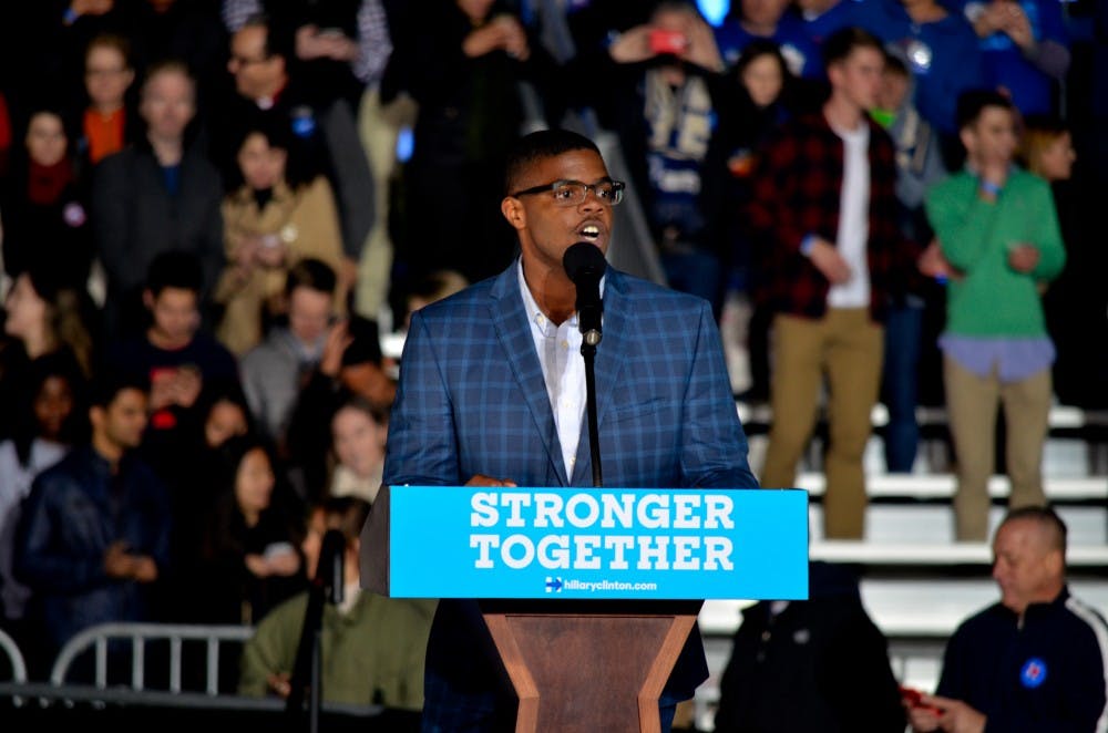 College senior Barry Johnson, who took a leave of absence to be an organizer with the Clinton campaign, was the first person to speak on stage before the night’s roster of local and Democratic politicians.