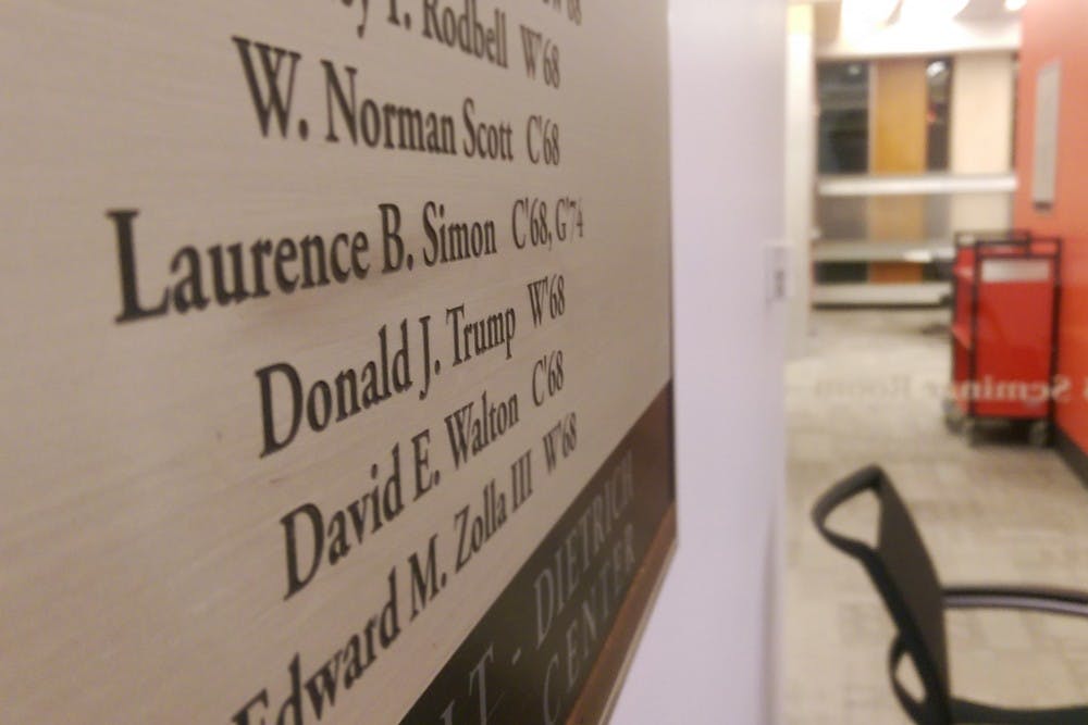 Donald Trump's name is displayed on a Class Gift plaque in the Class of 1968 Seminar Room in Van Pelt, the only spot on campus that shows evidence of Trump giving back to Penn.