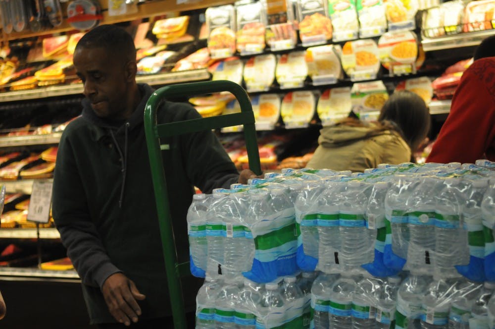 Students pack Fresh grocer in preparation for Hurricane Sandy