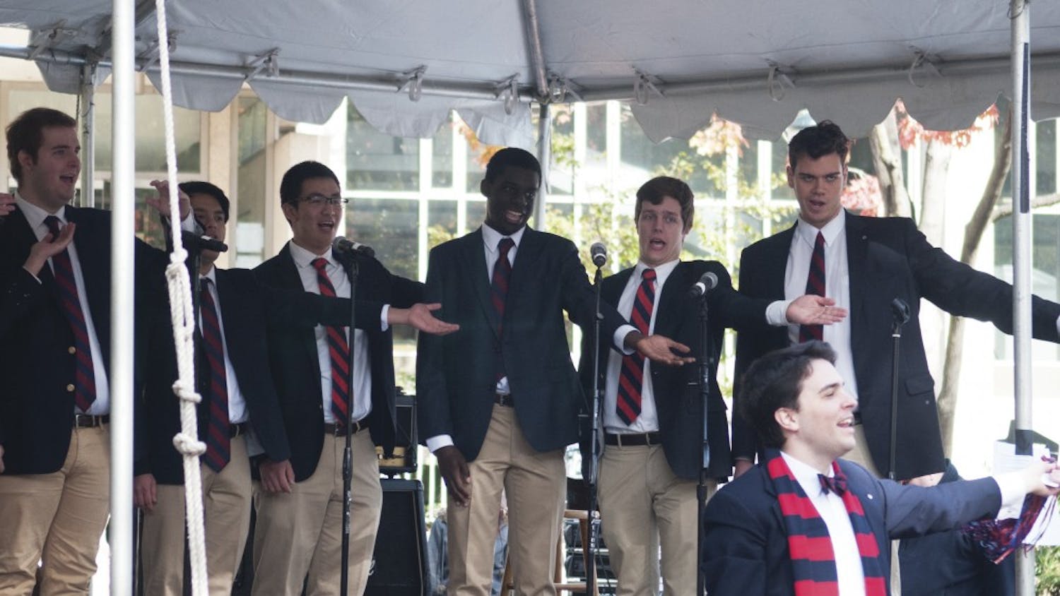 Glee Club members are delivering these singing valentines during “tech week” for this weekend's spring production, “Where There’s Money There’s Treble.”