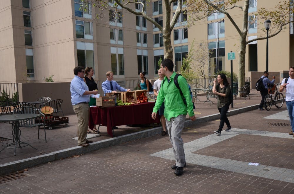 Wednesday: Penn Dining advertised with a stand on Locust Walk.