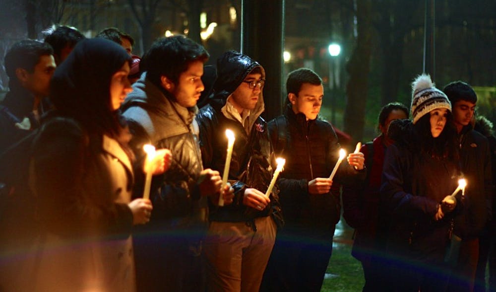 Penn Pakistan Society hosted a candlelight vigil for the 141 people killed in a Taliban attack on a school in Peshawar.