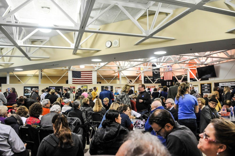 Over 300 people gathered to caucus for Clinton, Sanders and O'Malley in Clive, IA on Monday night.