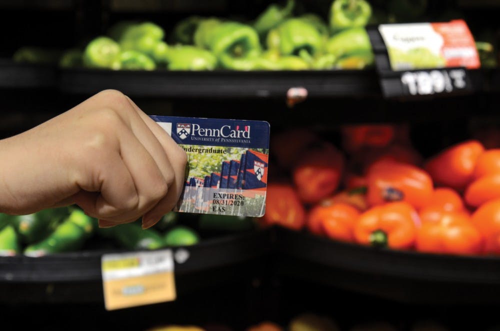 College seniors Jessica Abrams and Liza Lansing hosted Wednesday's Swipe Out Hunger Donation Day, resulting in more than 1,000 student-given swipes that will go to their peers in need.