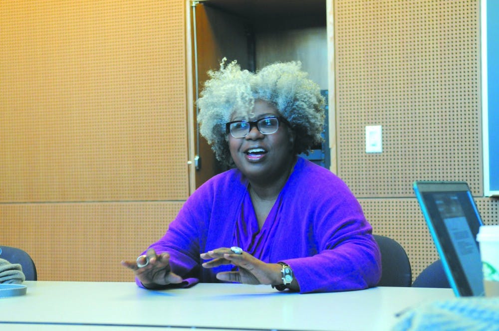 Religious studies professor Anthea Butler gives an interview in Fisher-Bennett Hall.