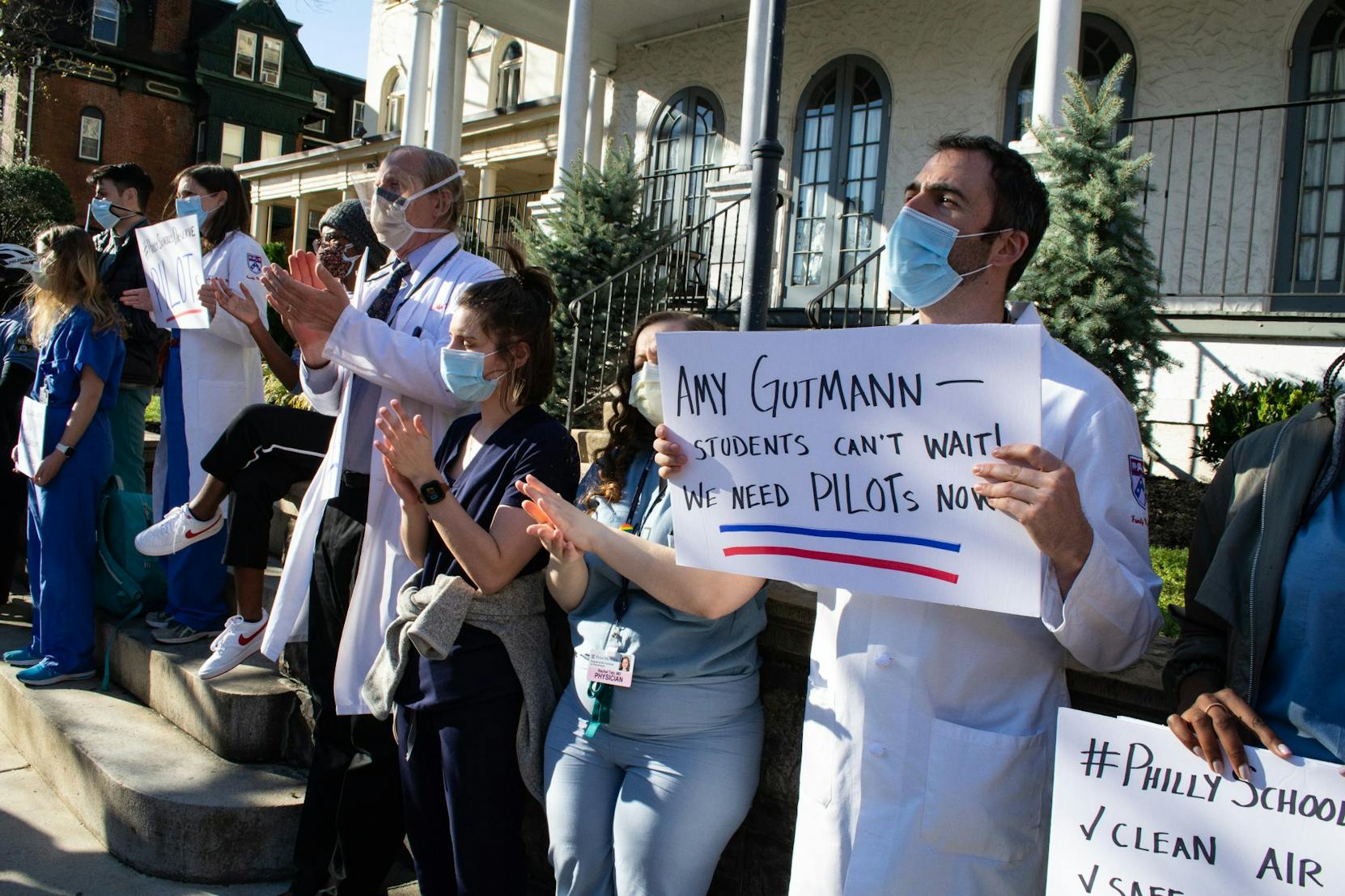 03-30-21 March For PILOTs Amy Gutmann Sign Penn Family Medicine Masks COVID-19 (Nicholas Fernandez).jpg