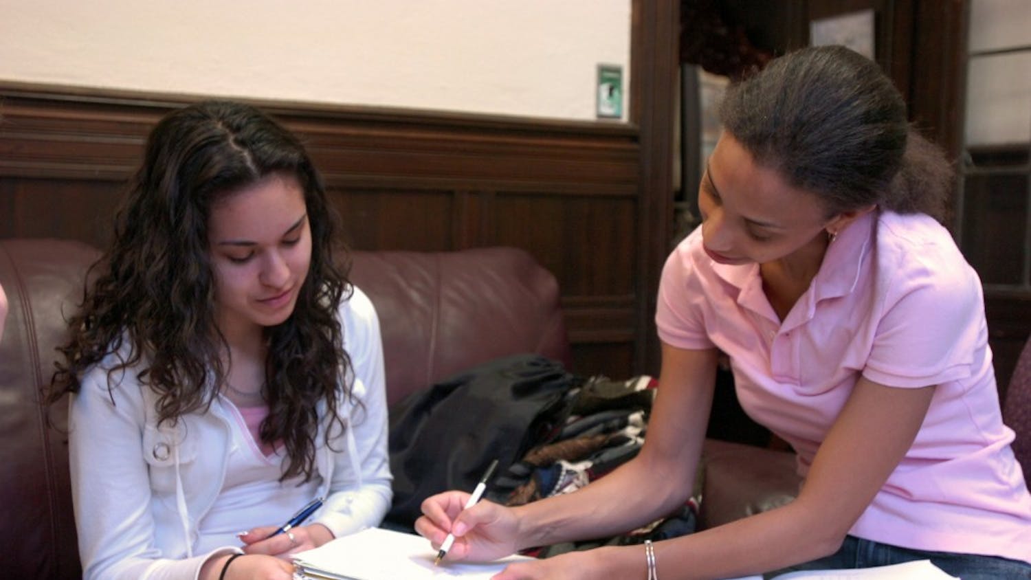 Angelina Benson tutors high school senior Vanessa Martinez in SAT Math.
