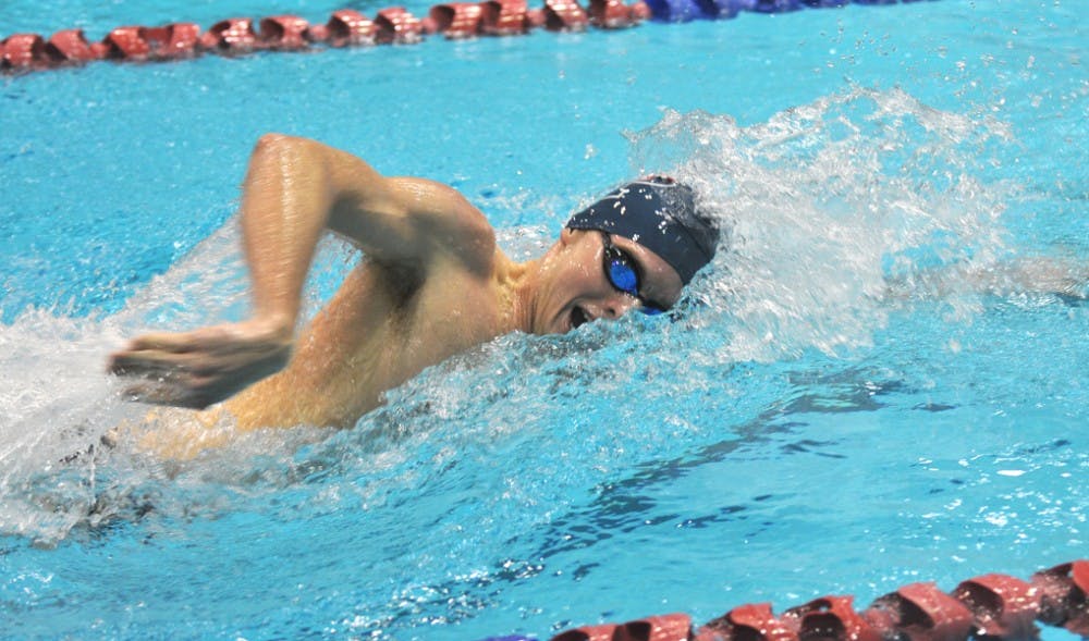 Men's swimming defeats Cornell and loses to Princeton in a tri-meet.Chris Swanson