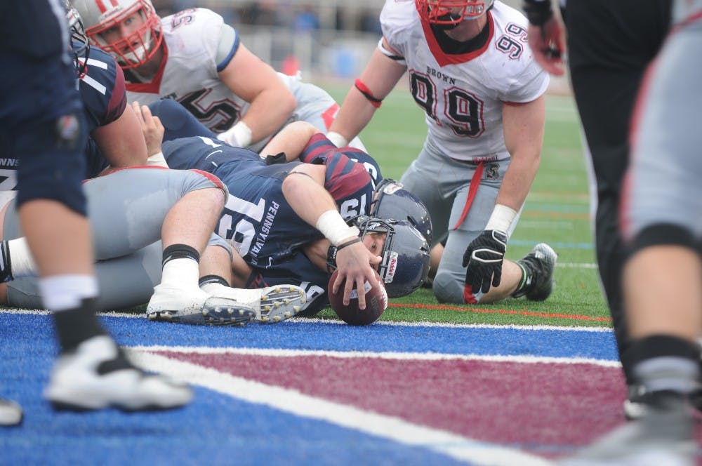 Quarterback Adam Strouss falls into the end zone for a one-yard touchdown run late in the first half of Penn football's homecoming game vs. Brown.