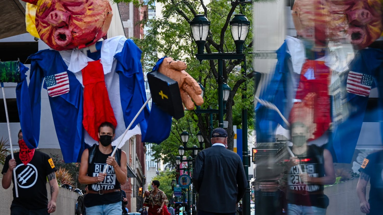 Photo Essay | Trump’s Phila. town hall met with chants, fists, and signs from protesters