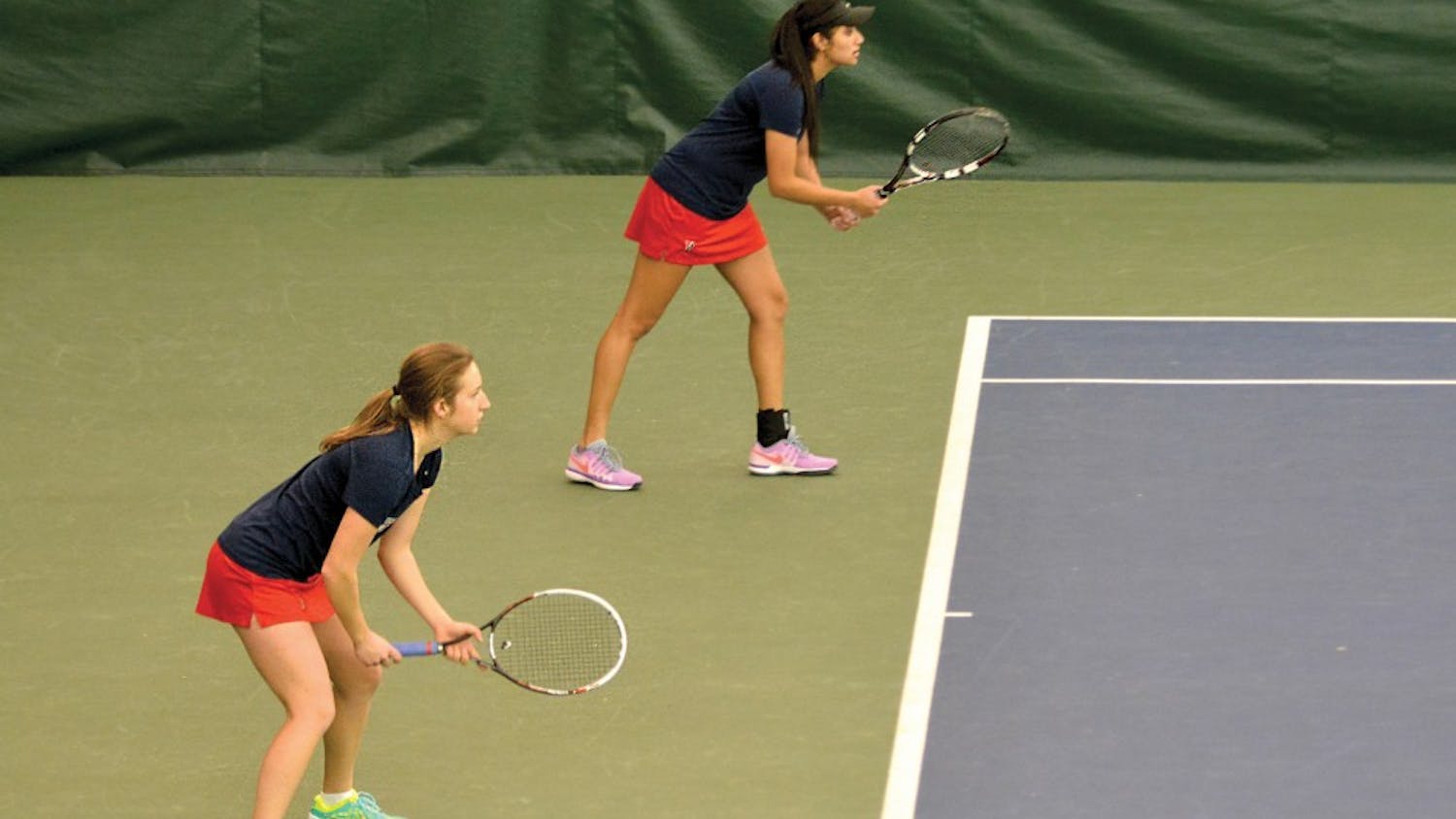 Freshman Marta Kowalska (left) picked up both singles and double wins on Saturday versus Harvard, helping the Quakers to a weekend sweep.