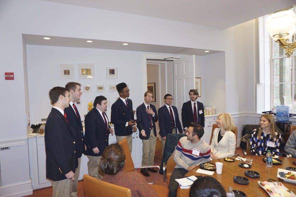 Members of the Glee Club serenade Penn President Amy Gutmann.