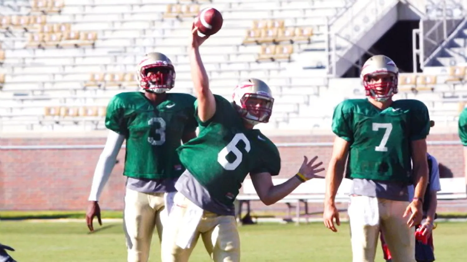 Fifth-year senior Ryan Becker with current NFL quarterbacks E.J. Manuel (left) and Christian Ponder (right). Becker left Florida State after one season to join the Quakers.