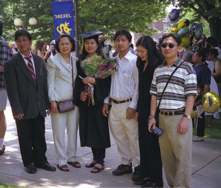 	Don Ly (far left) stands with his family at his oldest daughter’s college graduation. 