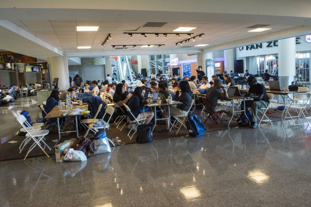 PennApps teams fill the tables on the ground floor of Wells Fargo Stadium.