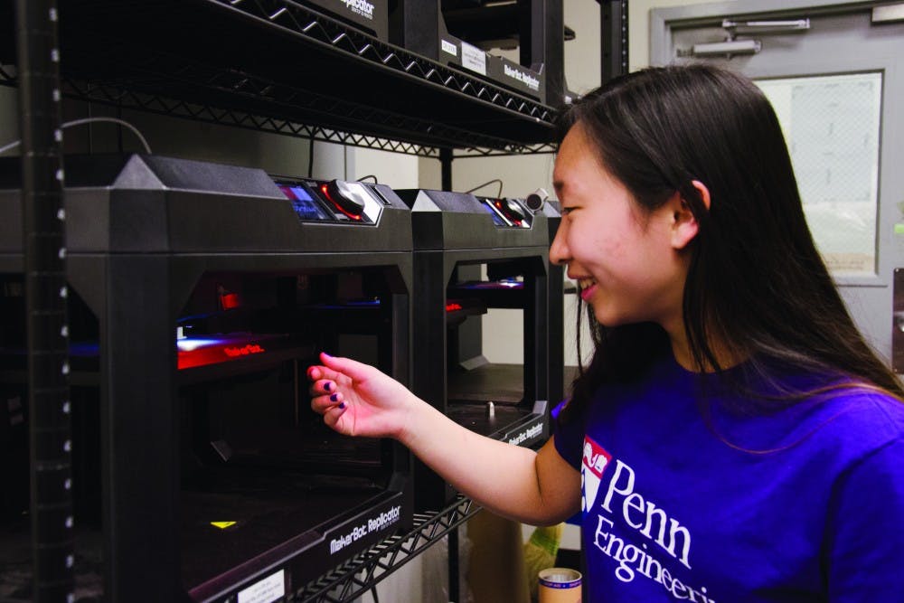 Engineering sophomore Julia Lin works with laser cutting and 3D printing in Penn's Rapid Prototyping Lab. She is also the co-founder and co-president of the Chinese yo-yo club on campus.