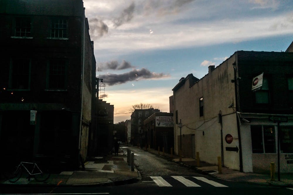 The sun set in Old City at the corner of 2nd and Race streets.