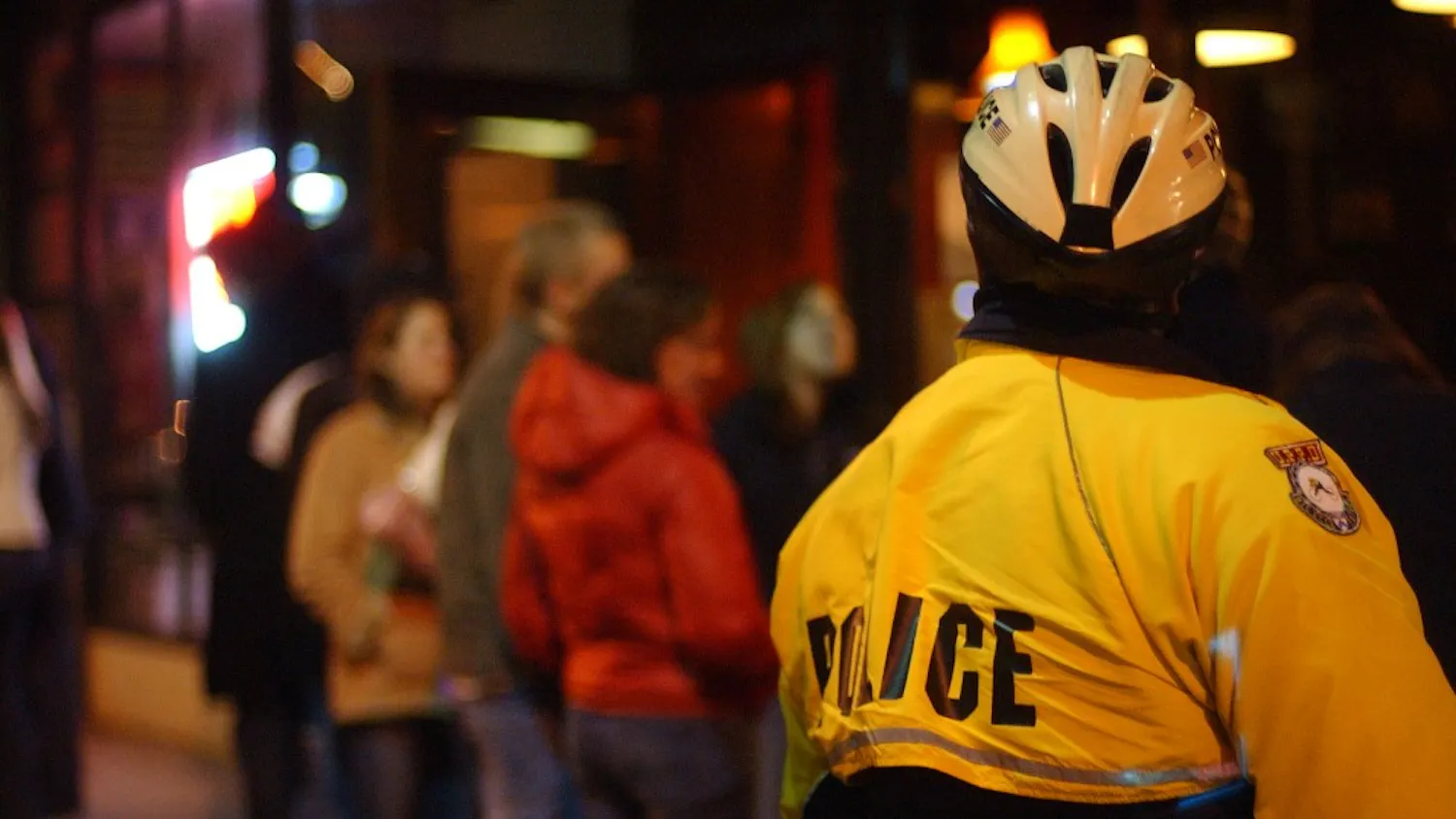 Officer Roberts from the UPenn Police department waits outside Smokey Joes as people begin to leave at around 2am on Sunday morning.