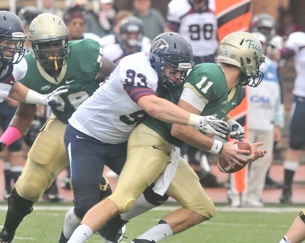 	Sophomore defensive tackle Austin Taps sacks William &amp; Mary senior quarterback Michael Graham early in the first half. Taps posted two sacks on the day against the Tribe. 