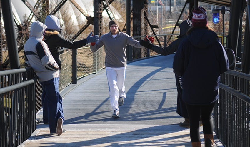 Amy Guttmann speaking as part of a launch of a new sports program between West Philly elementary schools and Penn Athletics