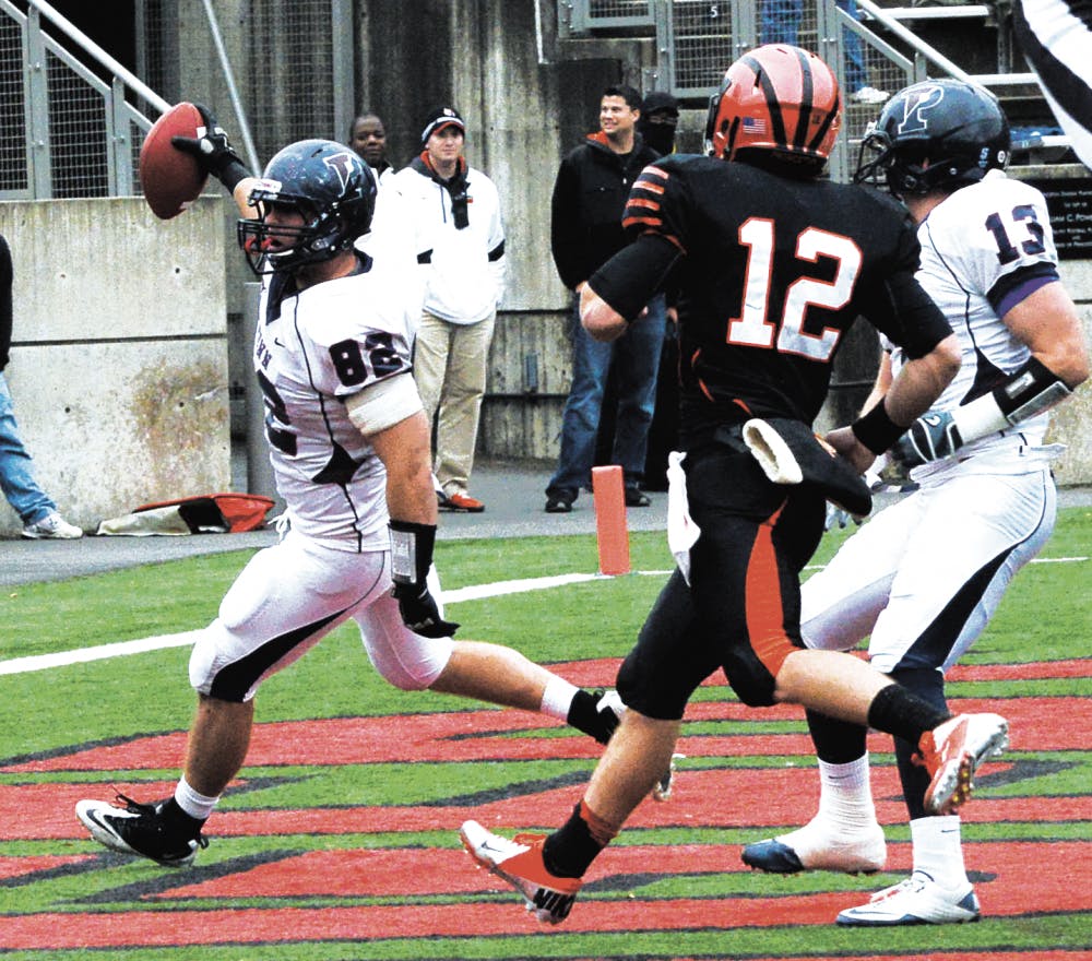 	Senior defensive end C.J. Mooney scored Penn’s game-tying touchdown off a 15-yard pick six in the fourth quarter Saturday. The Quakers eventually won, 28-21. 