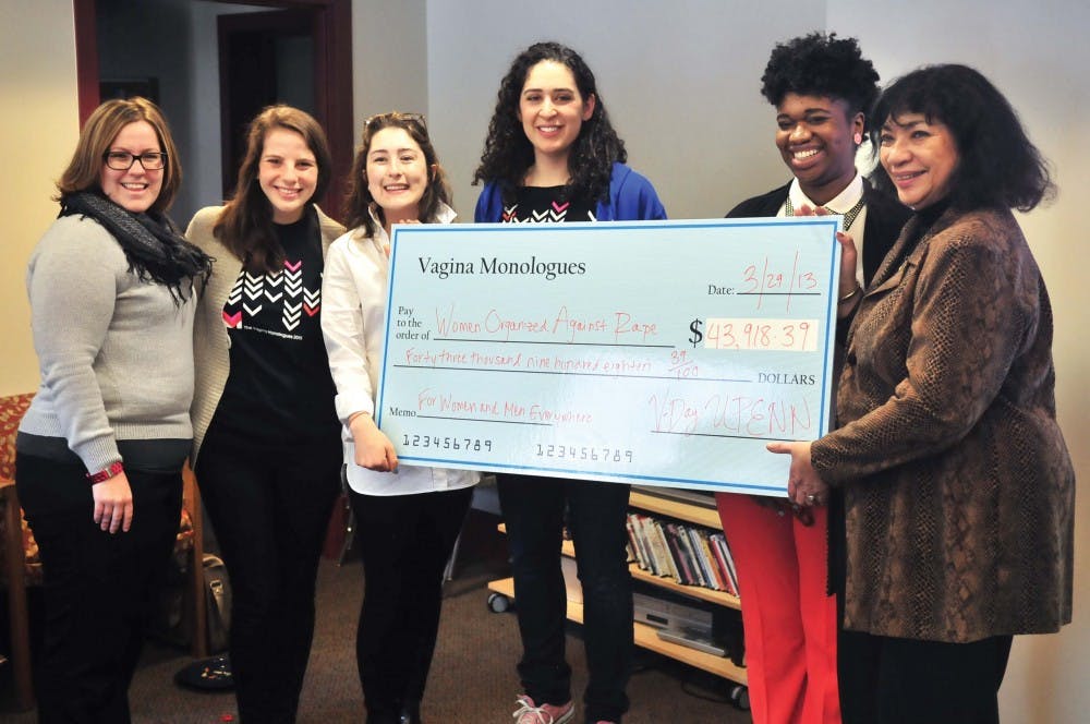 The Vagina Monologues presents their donation to WOAR