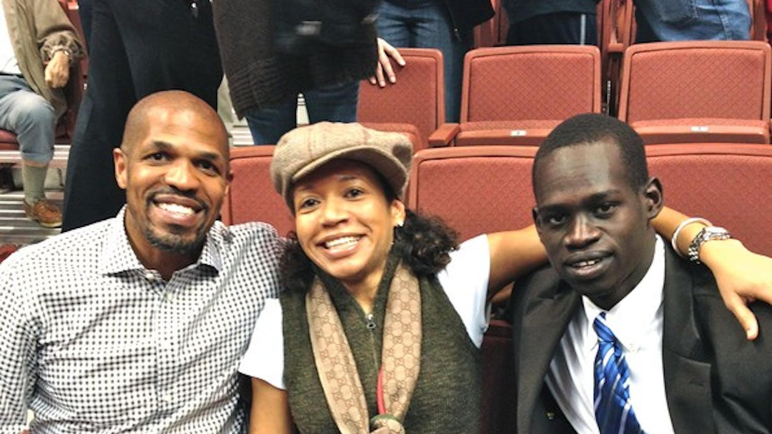 Over time, Dau Jok has become close with Penn graduate Kasia Muoto, (center) who started the We Play to Win foundation that promotes youth empowerment.