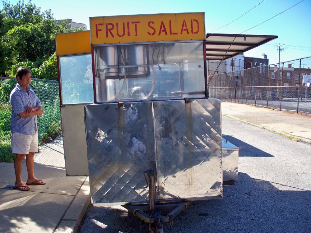 	Don Ly stands by his fruit truck near his Vollmer Street home. 