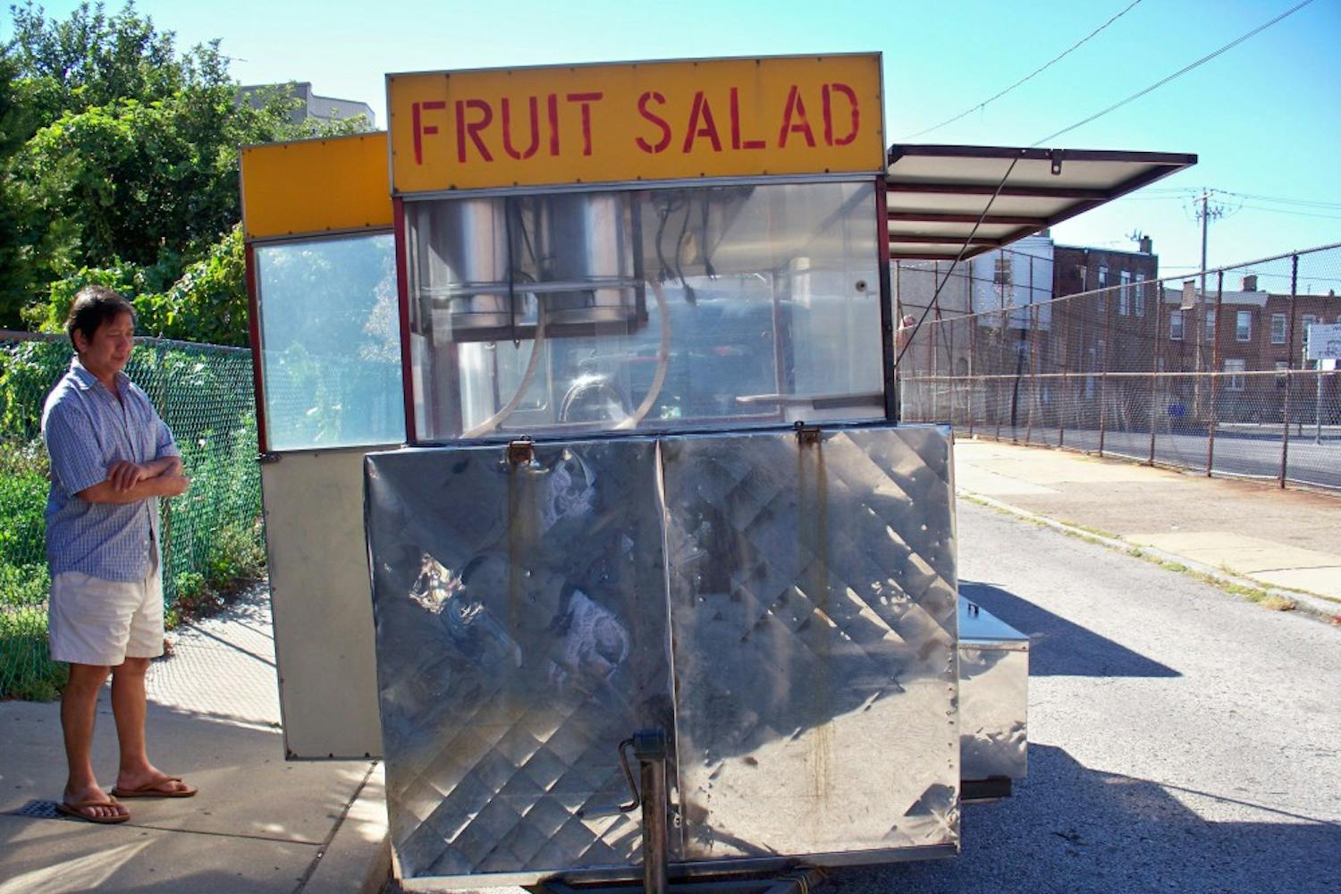 Don Ly stands by his fruit truck near his Vollmer Street home.