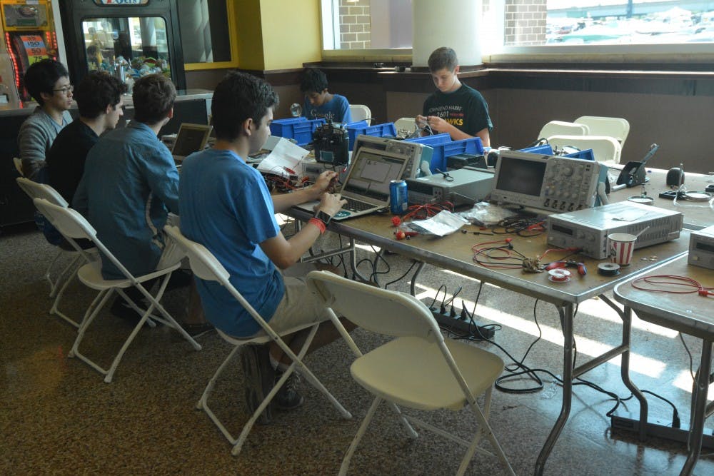 Hackers code and work on hardware solutions in the hardware section.