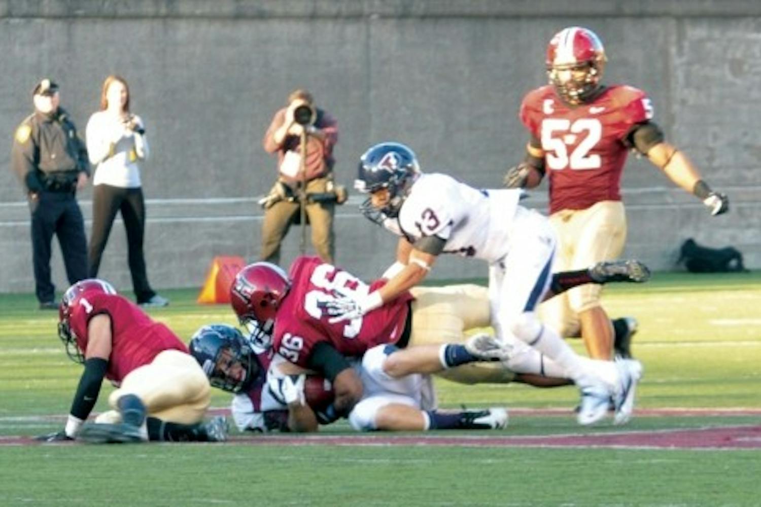 Penn football wide receiver Cam Countryman (R) has been charged with simple assault and reckless endangerment to another person.