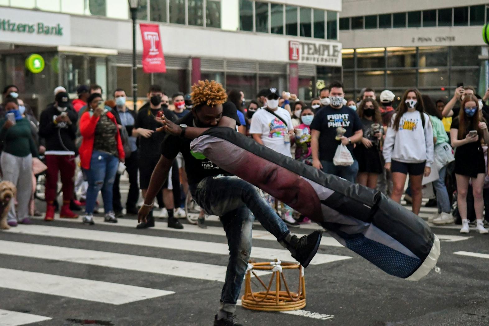 11-07-20 Penn and Philadelphia Celebrates Joe Biden Elected President of the United States Person Kicks Donald Trump Punching Bag Wider Angle.jpg
